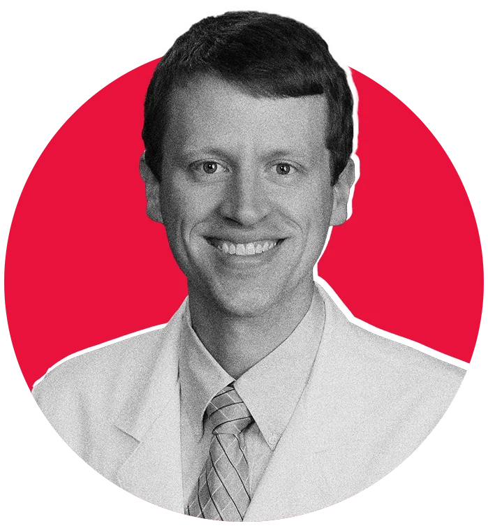 A grayscale image of YouTube Creator Doc Schmidt in front of a raspberry colored circle.
